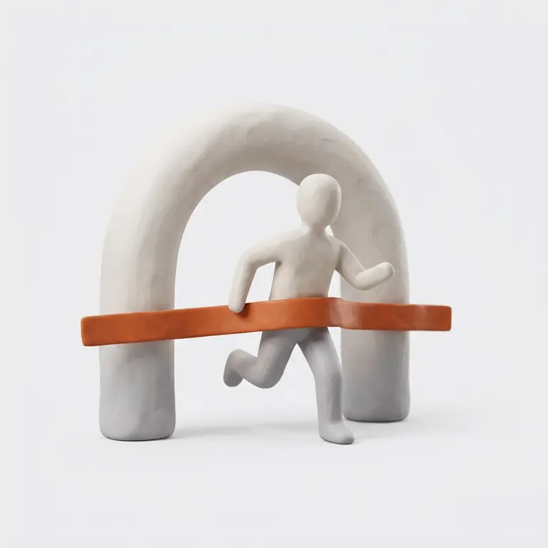 A clay runner breaking an orange finish ribbon